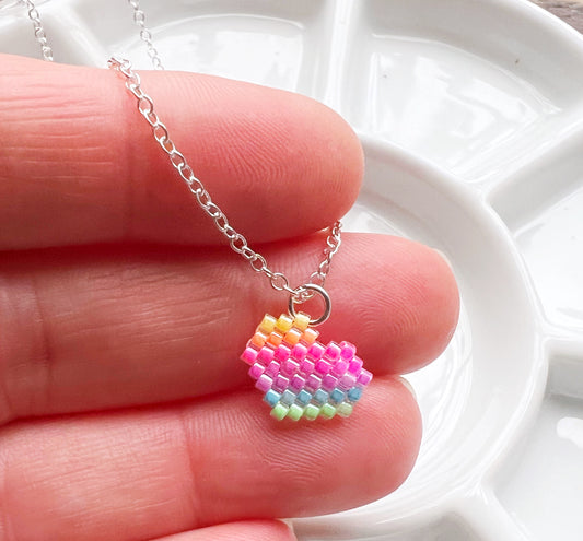 Tiny heart necklace with fluorescent UV rainbow beads