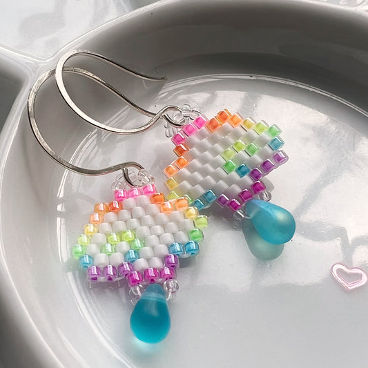 Rainbow cloud earrings with blue drop in florescent blacklight beads
