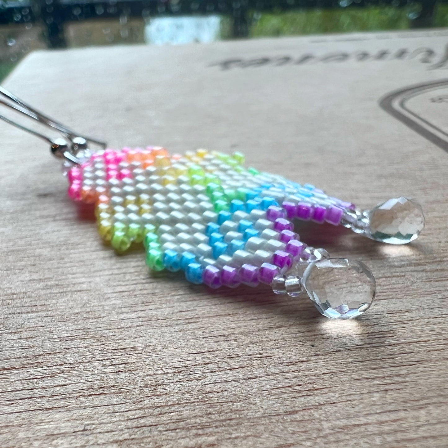 Raindrop cloud earrings in florescent blacklight beads