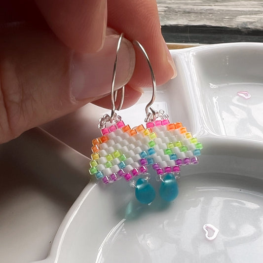 Rainbow cloud earrings with blue drop in florescent blacklight beads