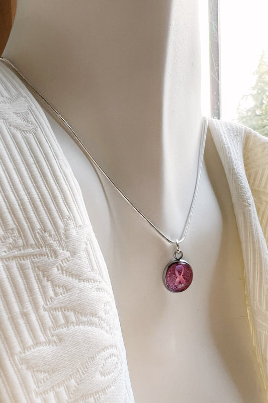 The pink ribbon necklace (gold or silver)