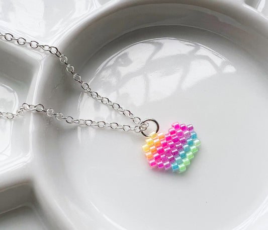 Tiny heart necklace with fluorescent UV rainbow beads