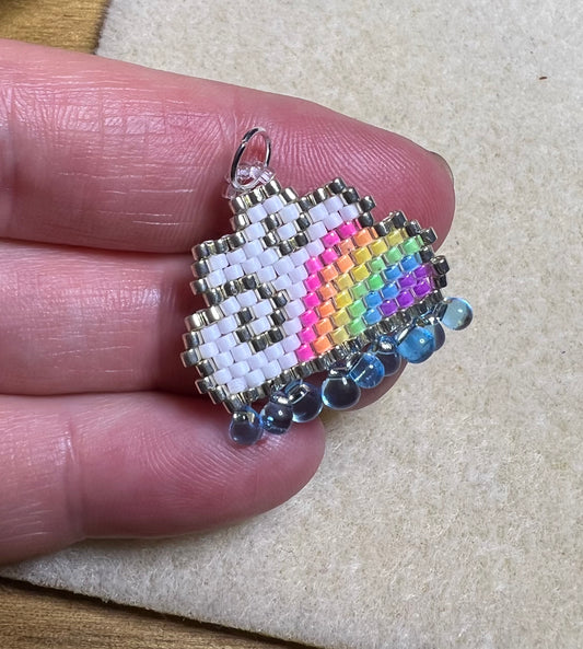 RESERVED Raincloud pendant with fluorescent UV rainbow beads