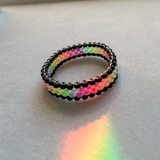 Banded ring in rainbow luminous blacklight beads (mini bead size)