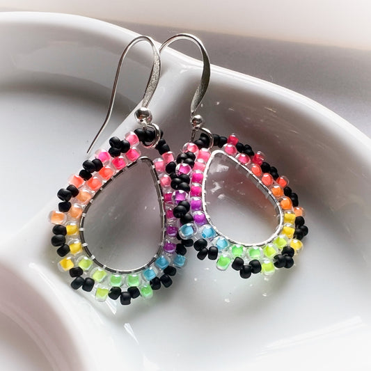 Rainbow drop earrings in florescent blacklight and black beads