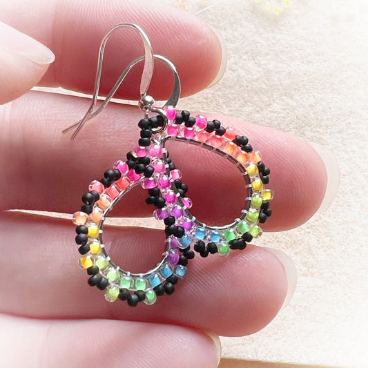 Rainbow drop earrings in florescent blacklight and black beads