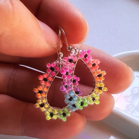 Rainbow flower drop earrings in florescent blacklight beads