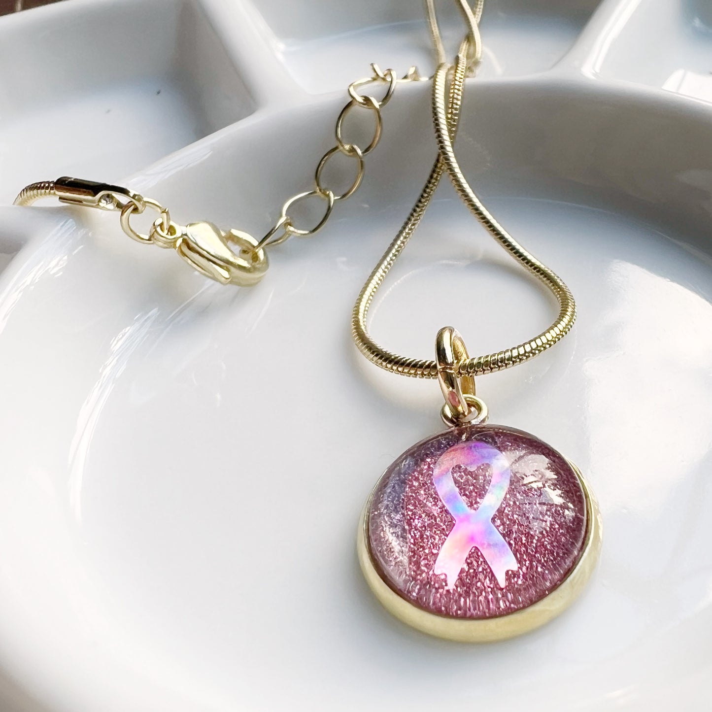The pink ribbon necklace (gold or silver)