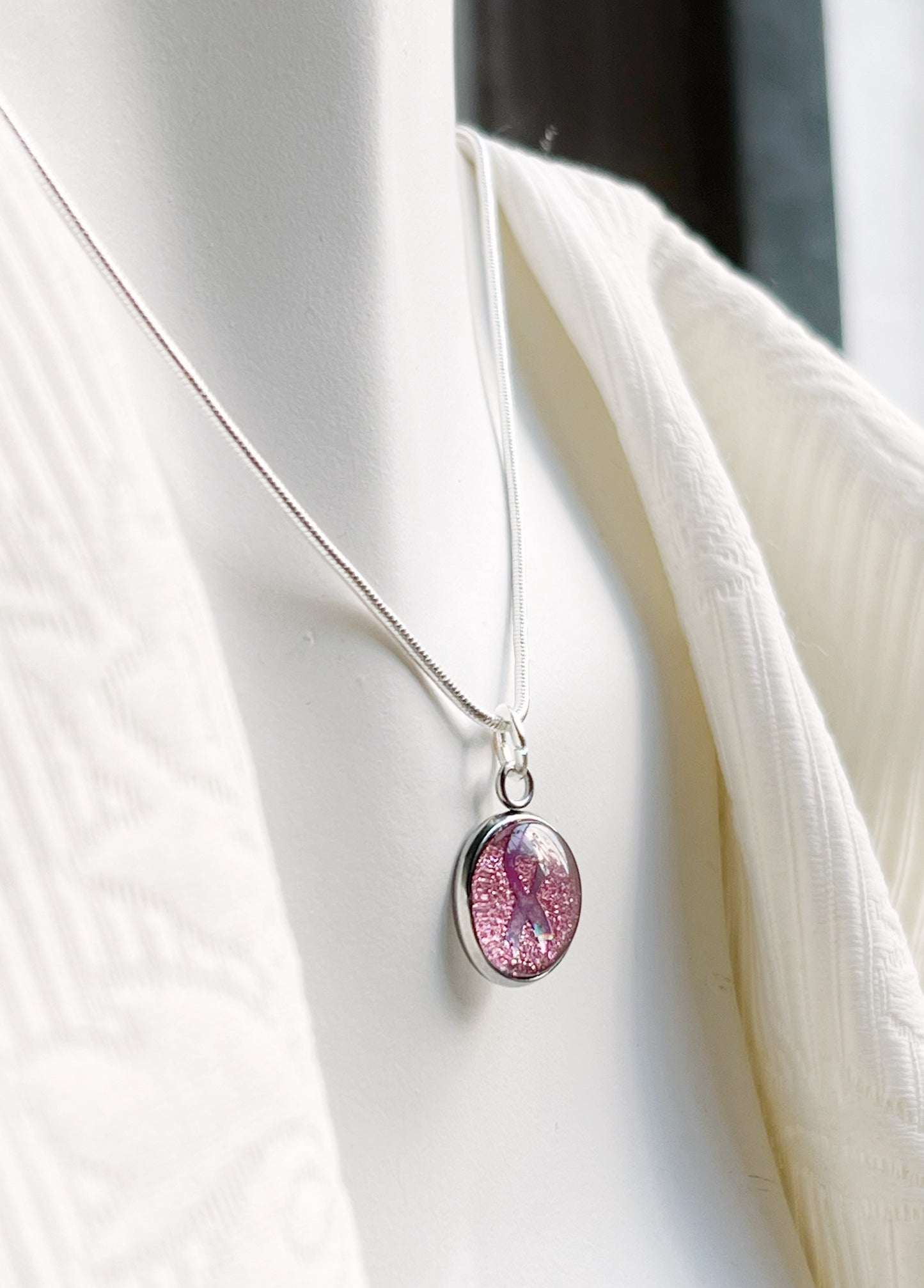 The pink ribbon necklace (gold or silver)