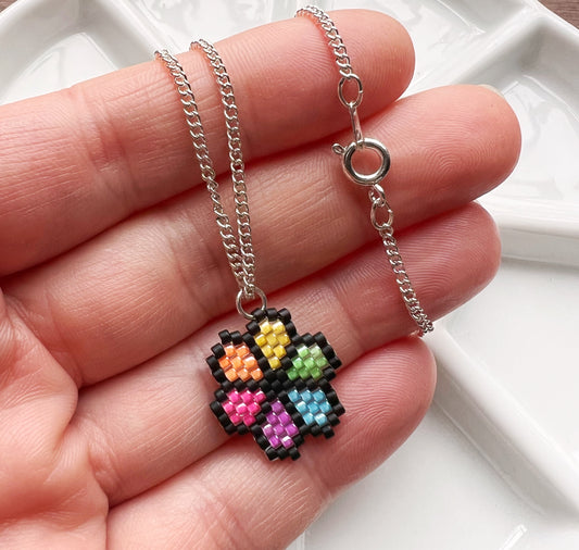 Flower necklace with fluorescent UV rainbow beads