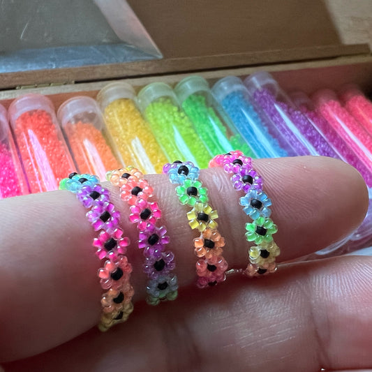 Flower ring in rainbow luminous blacklight beads (mini bead size)