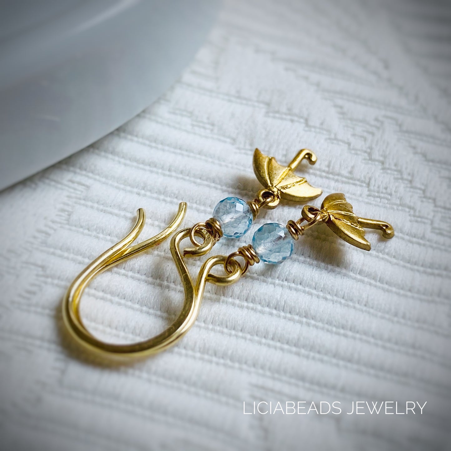 Dainty blue topaz gemstone and umbrella earrings