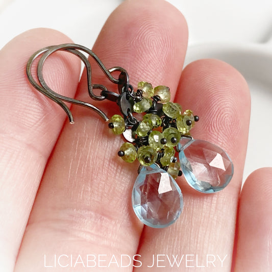 Blue Topaz and peridot gemstones on blackened sterling silver